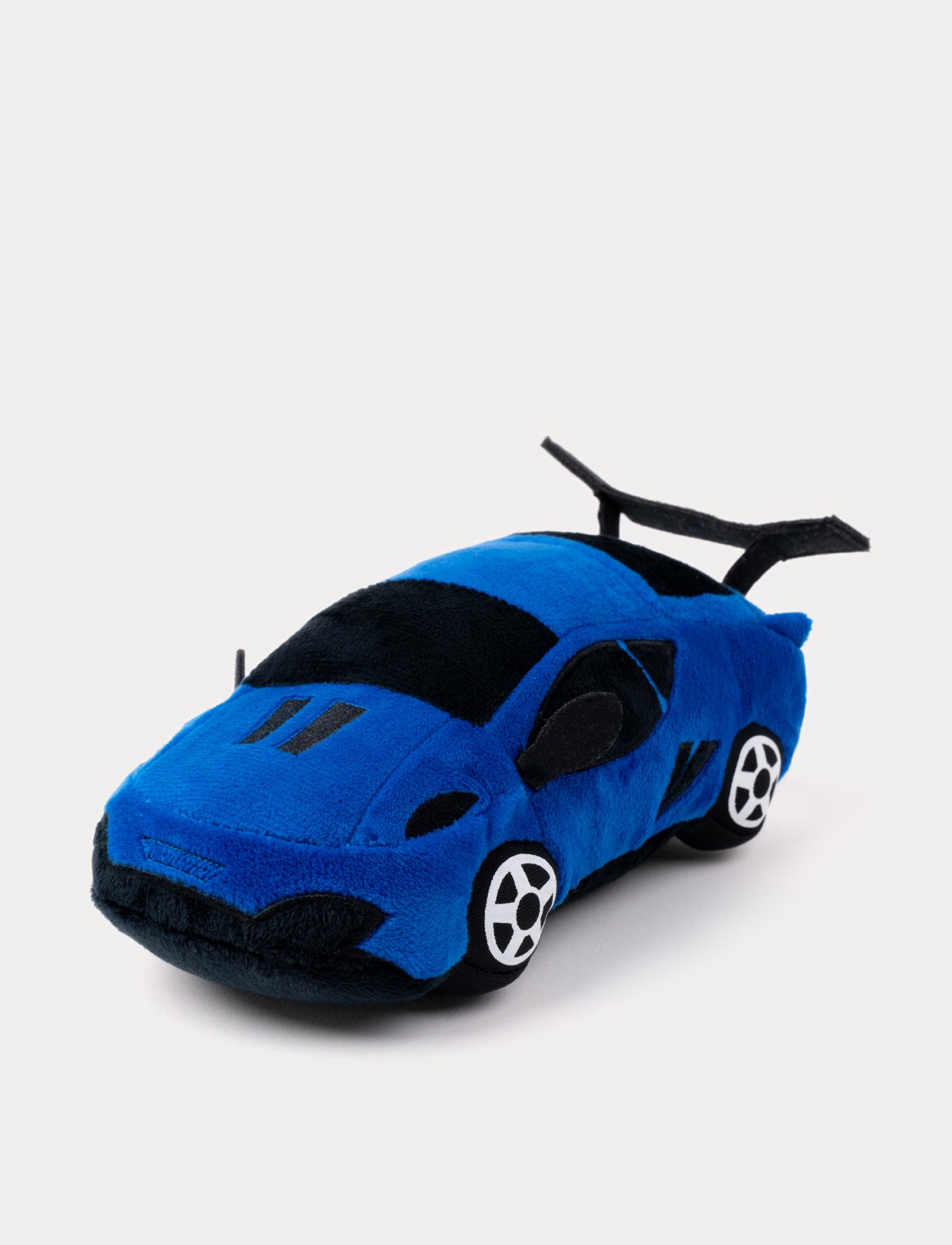  Image of A plush sports car in blue with soft fabric, embroidered details, and a playful design