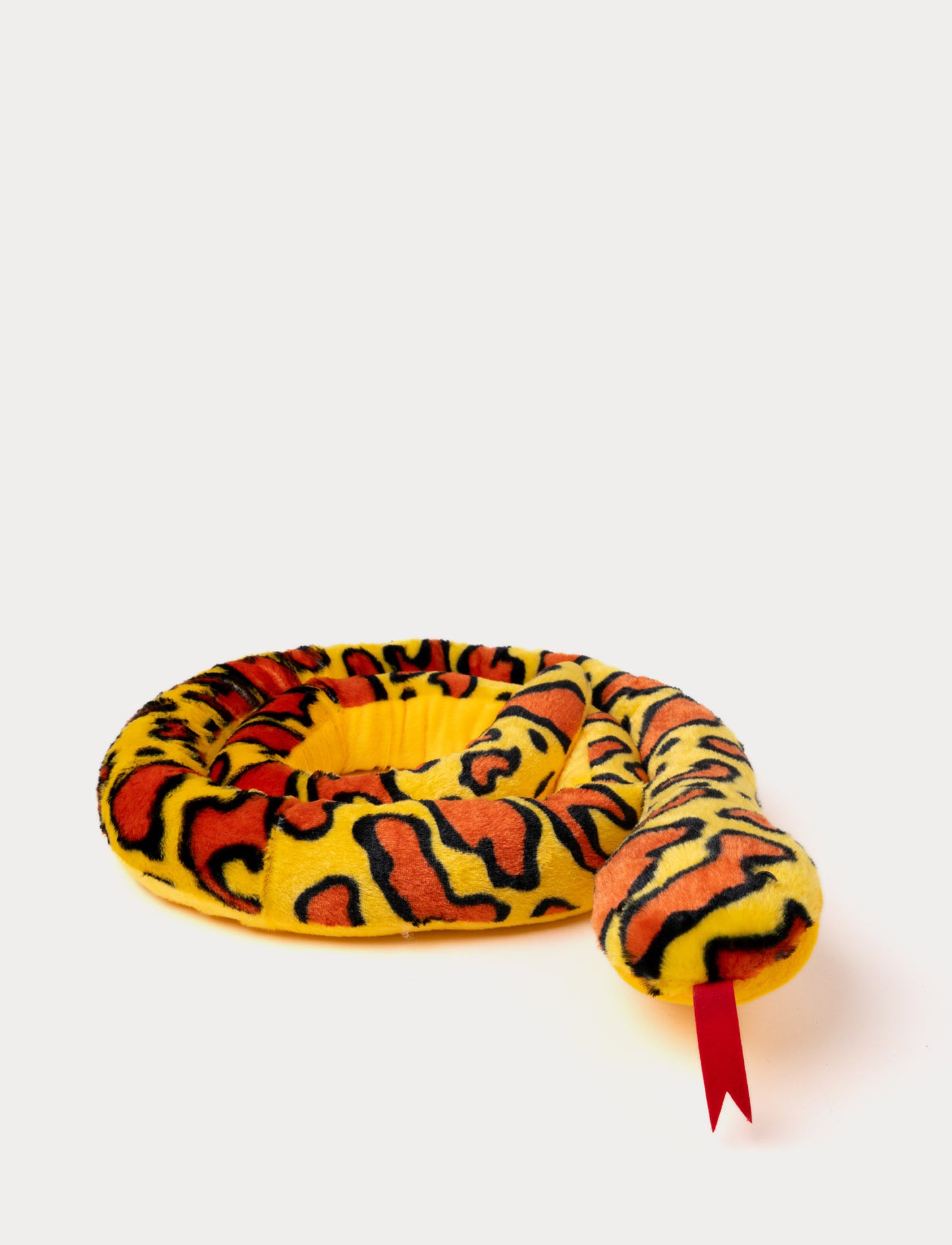 Long, plush yellow snake with orange and black details, with a soft texture.