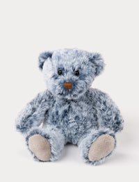 A small teddy bear with a soft plush coat in beautiful blue tones and unique marbled design.