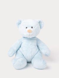 A small teddy bear with short, plush light blue fur and carefully stitched details.