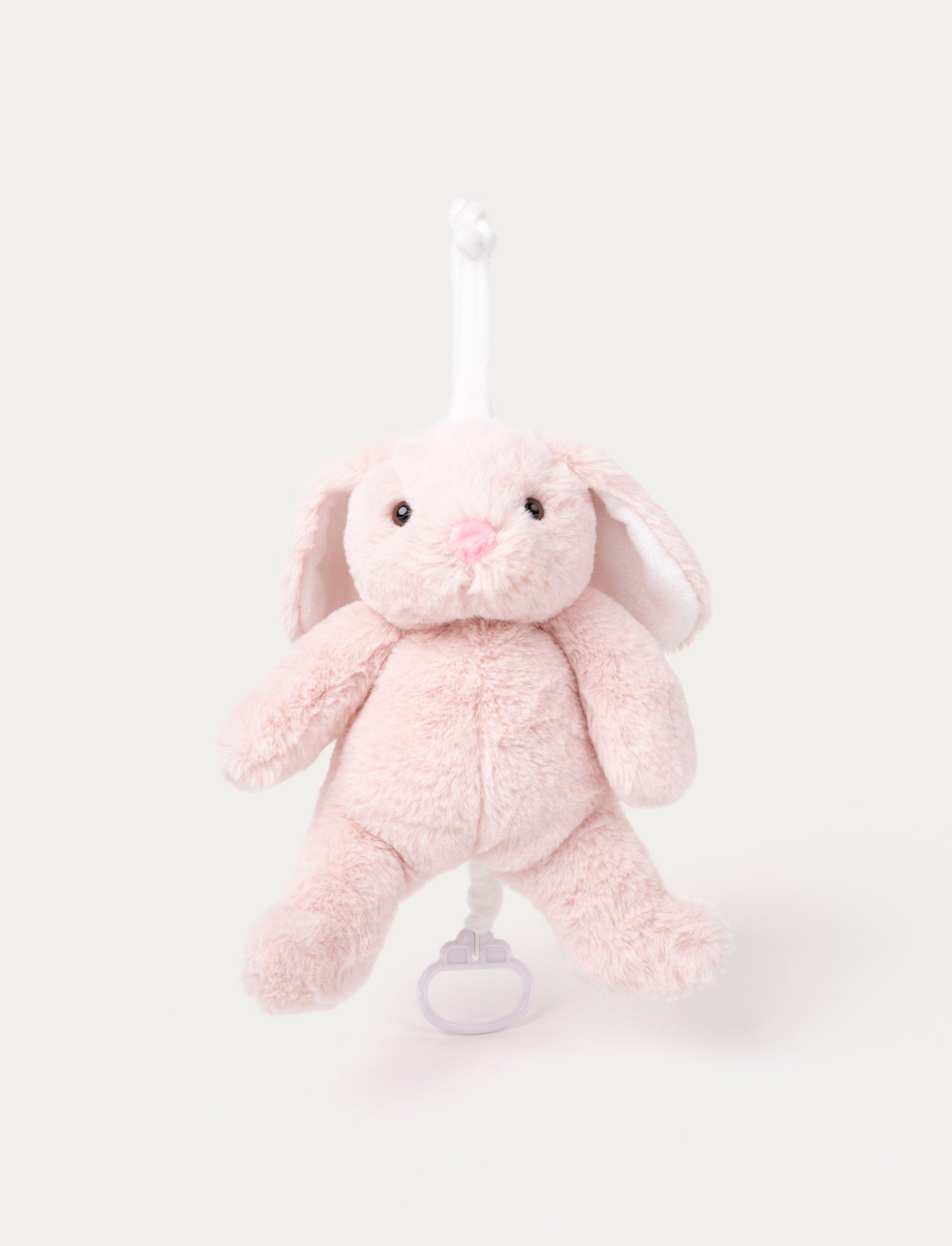  Image of Soft pink plush bunny music toy with floppy ears, black bead eyes, and a pull string for playing a lullaby.
