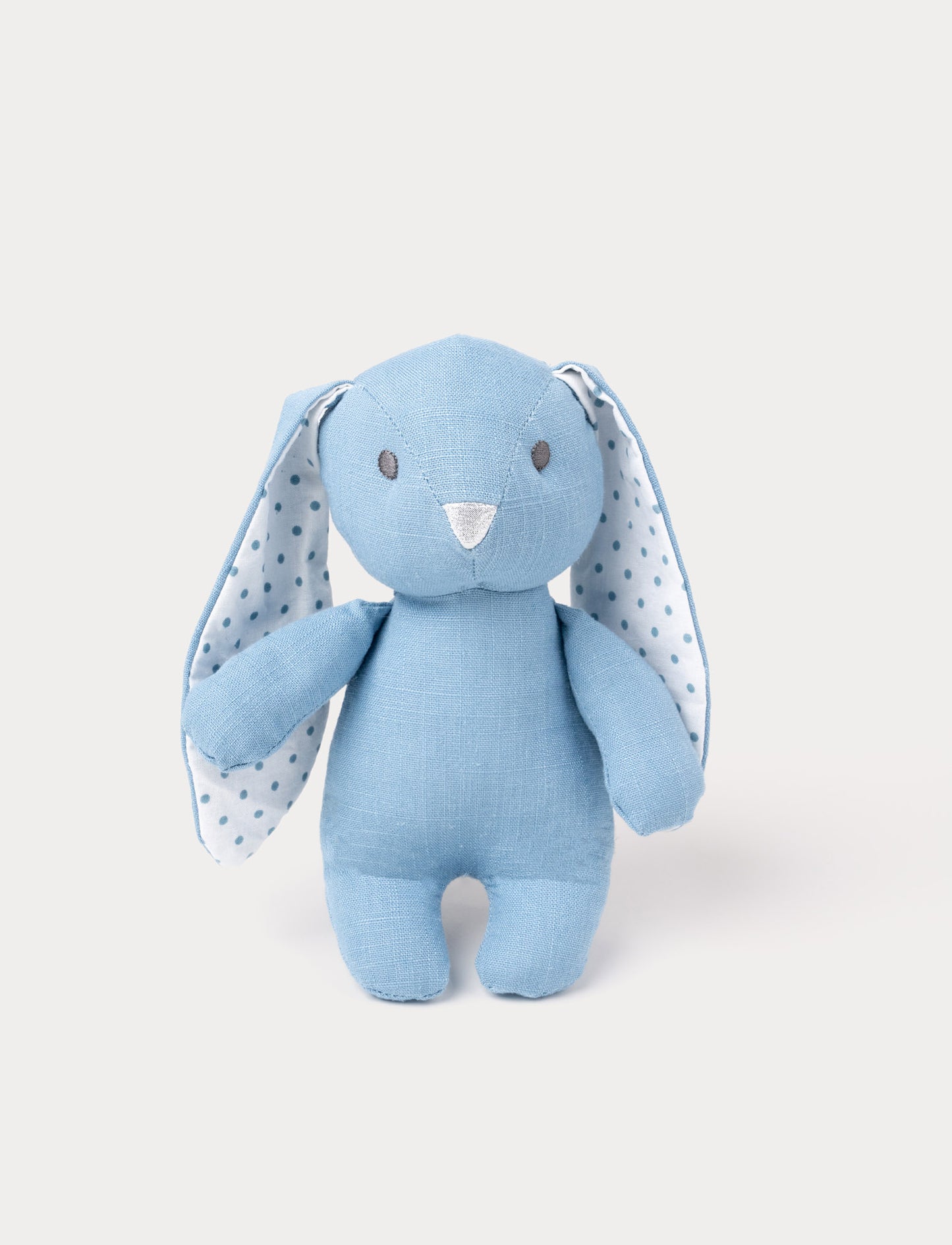 A bunny with sky blue cotton, large white ears with blue polka dots, and a silver nose.