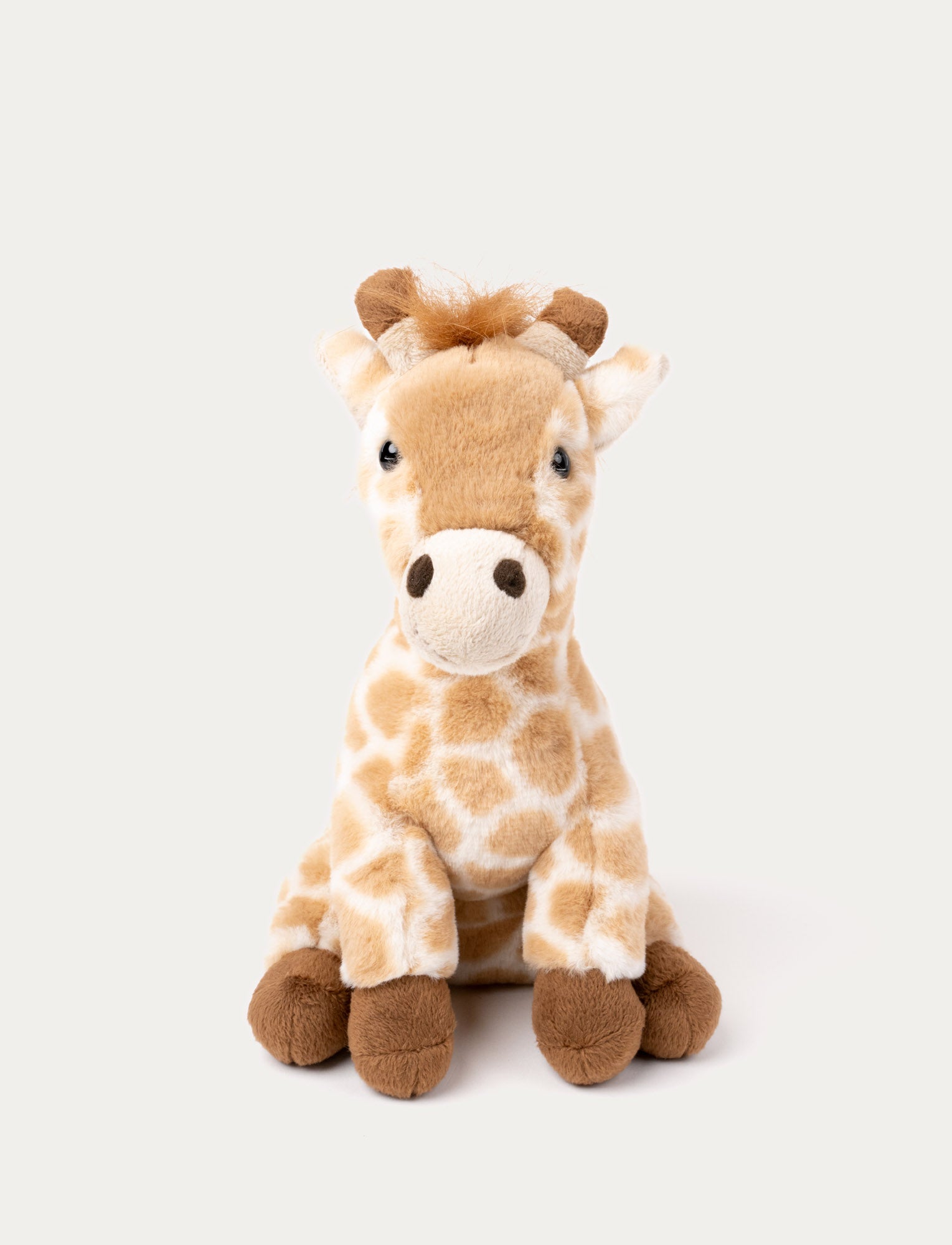  Image of Soft plush giraffe with a light brown and cream spotted pattern, brown hooves, and a fluffy mane.