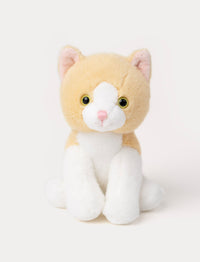 Soft plush cat with light orange fur, white face and paws, round yellow eyes, and a pink nose.