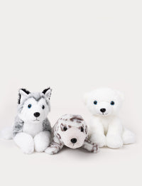 Three plush animals—a husky, a spotted seal, and a polar bear—sitting side by side on a white background.