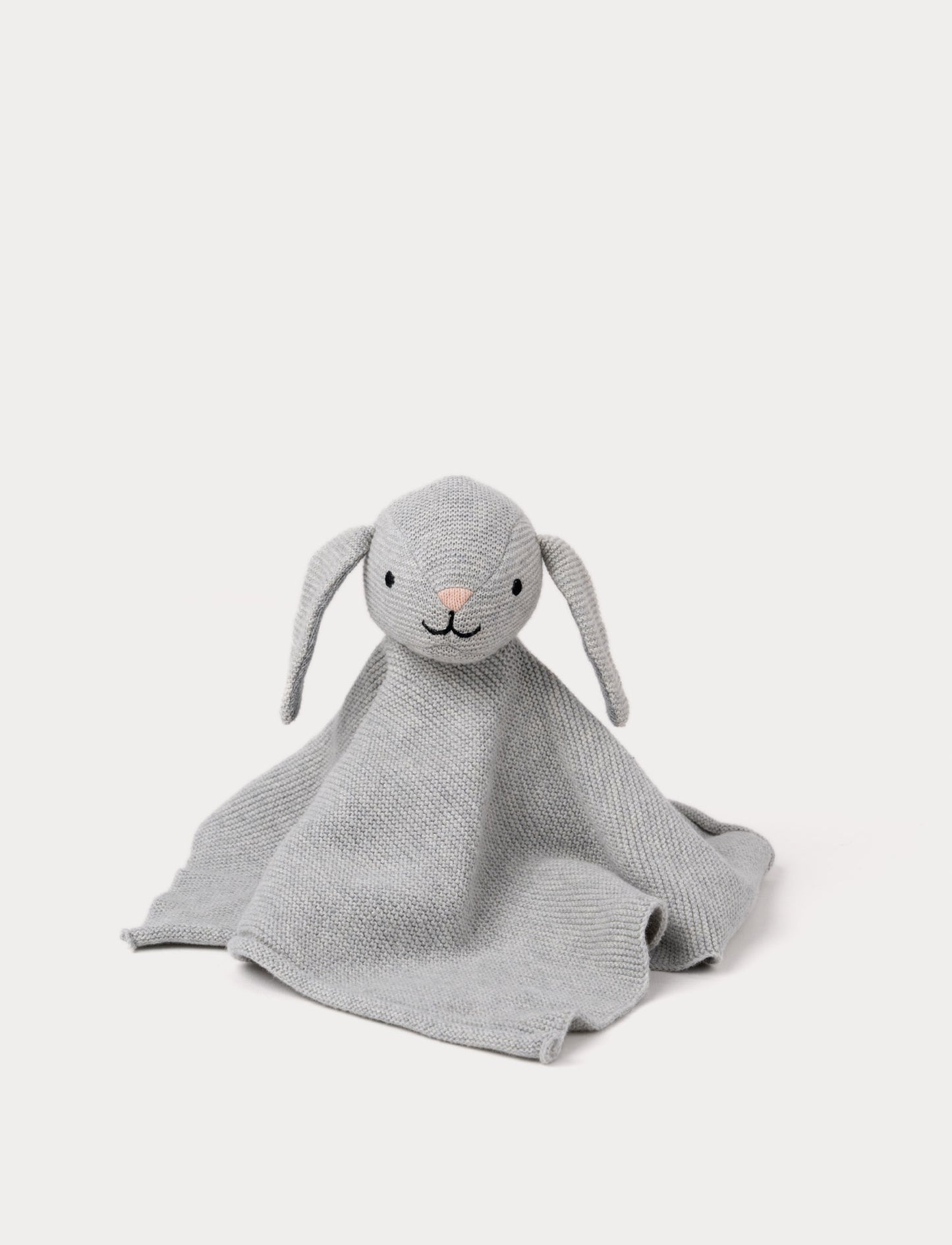A knitted grey bunny comforter with floppy ears, a stitched face, and a soft textured fabric.