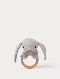Knitted grey bunny teething ring with floppy ears, embroidered facial features, a bow, and a smooth wooden handle.