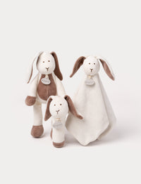 Set of three soft bunny toys in white and brown, including a plush, a rattle, and a comfort blanket.