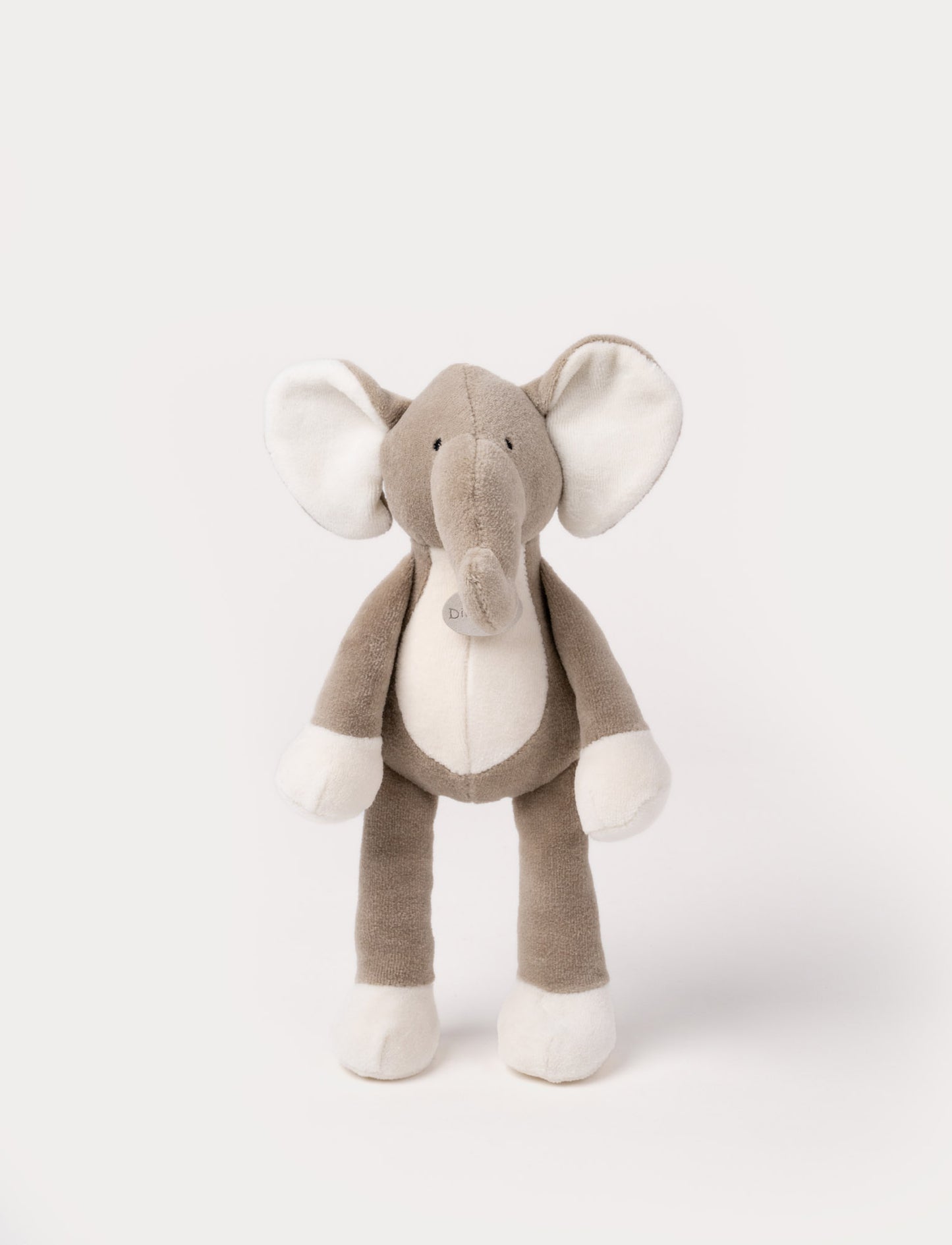 A soft plush brown elephant, with broaded eyes, white belly, ears and paws.