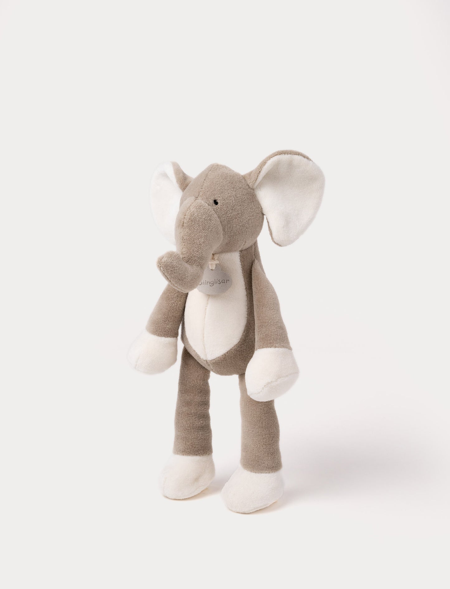 A soft plush beige bunny  with broaded eyes and nose, white, and brown details.