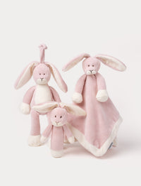 Set of three beige rabbit plush toys, including a rattle, comfort blanket, music box