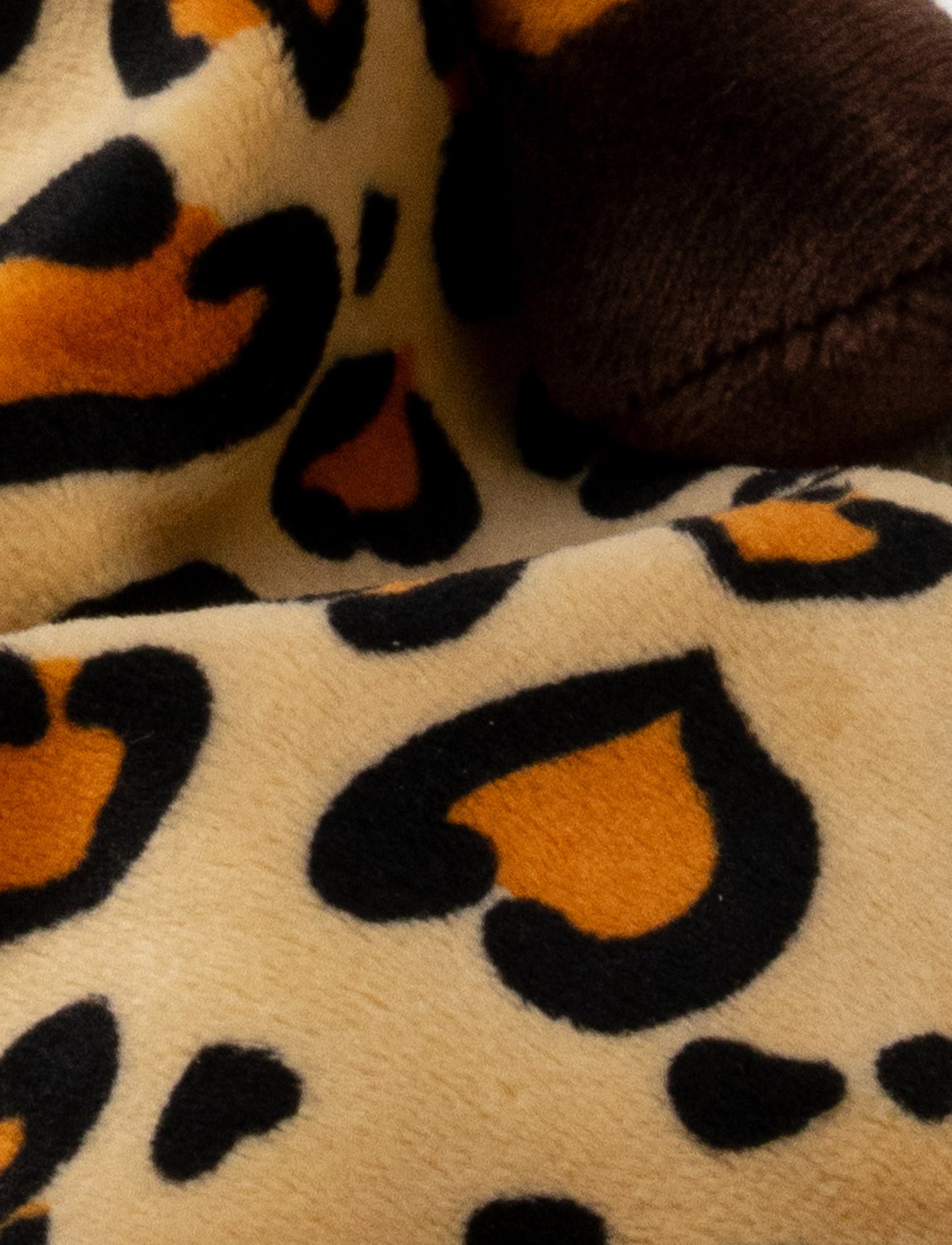 Soft baby blanket with a plush leopard head, spotted pattern, and dark brown trim.