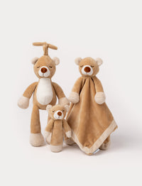 Set of three brown bear plush toys, including a rattle, comfort blanket, and music box.