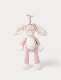 A plush dusty pink bunny music box with long floppy ears, a white belly, and a hanging loop