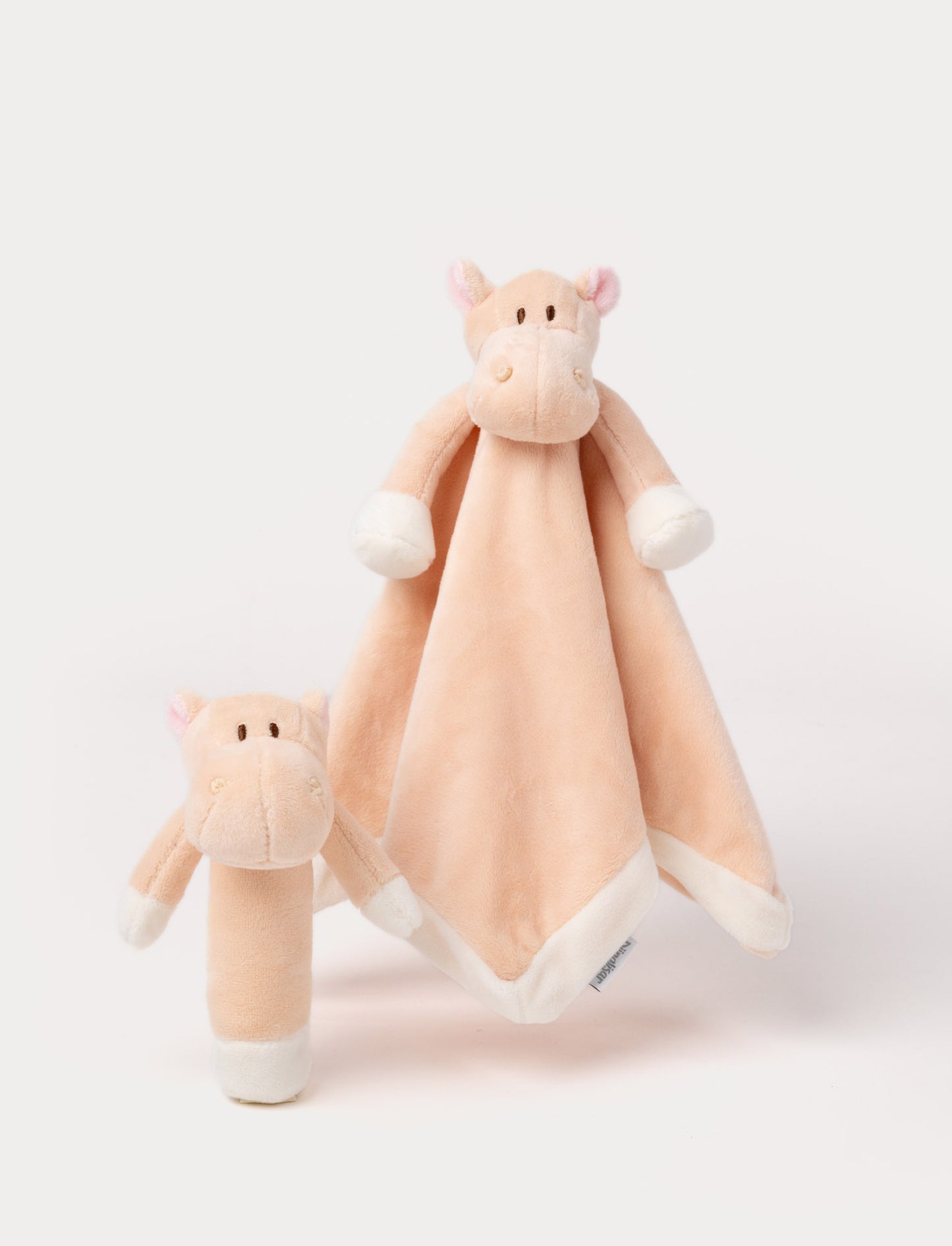 Set of two peach-colored hippo plush toys, including a rattle and a comfort blanket with a hippo head.