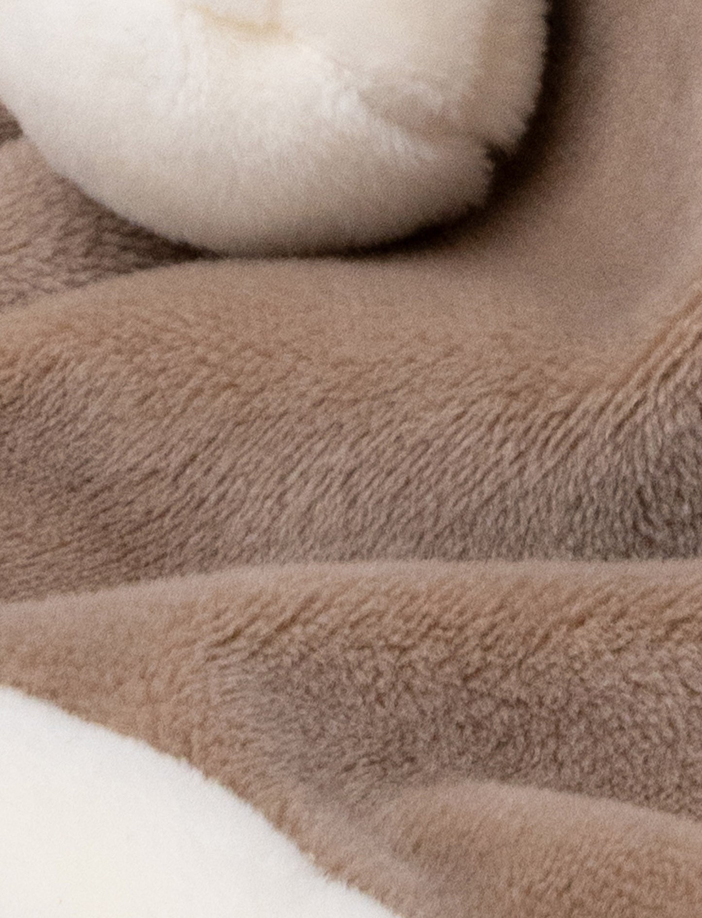Soft baby blanket with a plush brown hippo head, small pink ears, and white-trimmed edges.