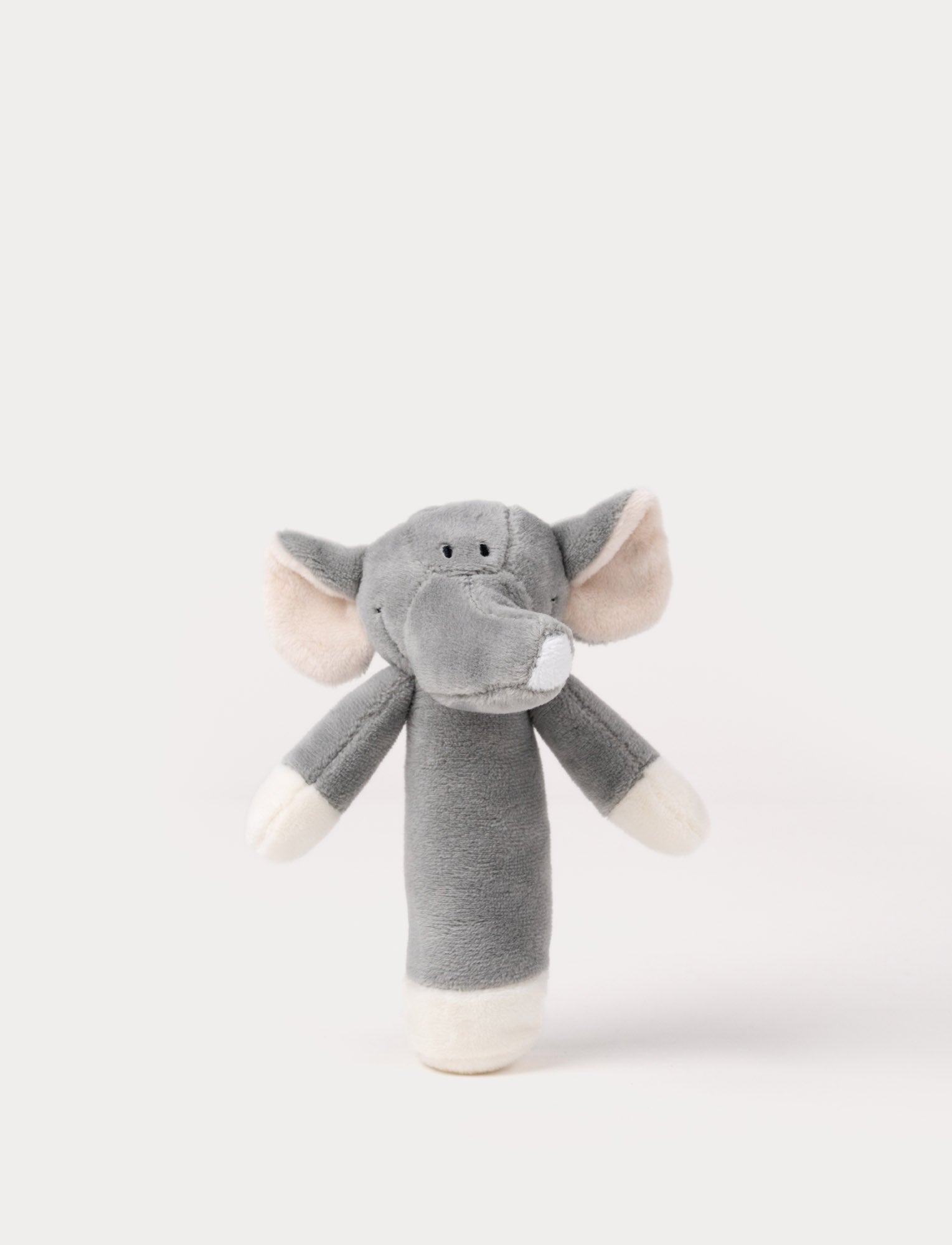  Image of Soft plush elephant rattle with a grey body, embroidered eyes, large floppy ears, and a long trunk.