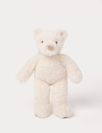 A small teddy bear with white fur, silky plush, and embroidered eyes.