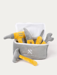 A plush toolbox in grey and yellow with a saw, hammer, screwdriver, and drill.