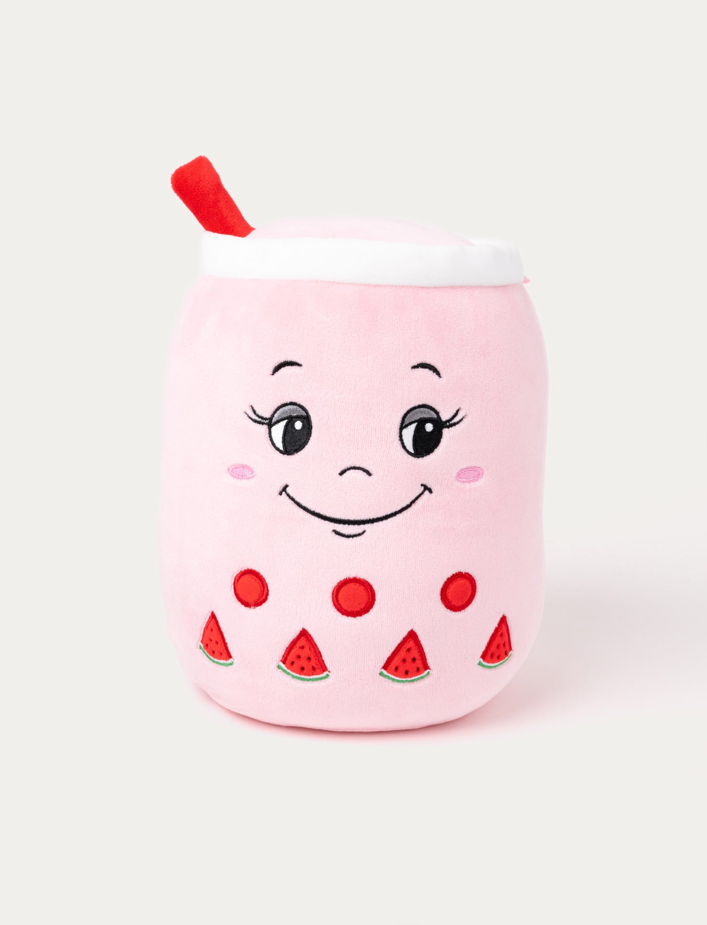 Pink plush bubble tea cup with a smiling face, red straw, and embroidered watermelon details.