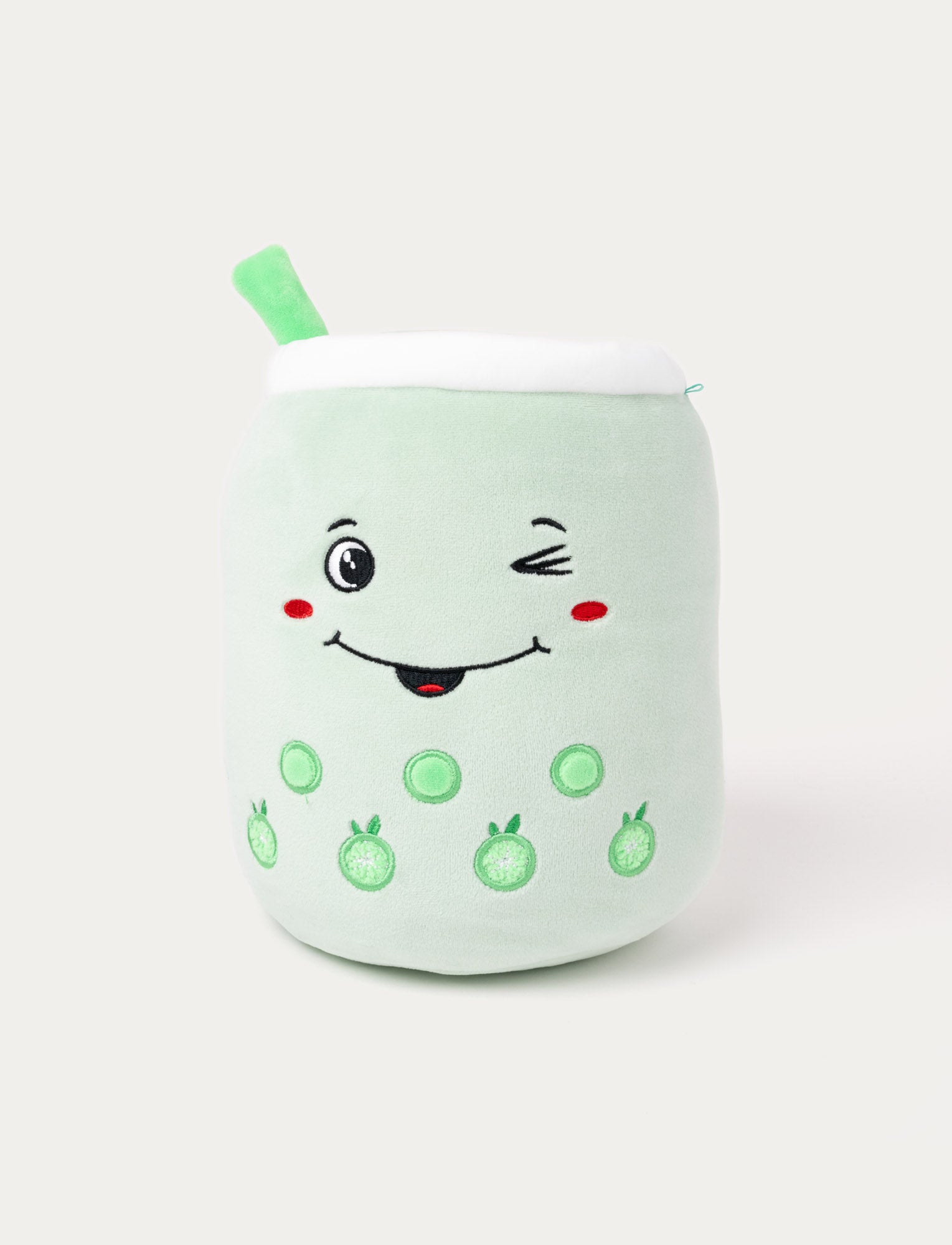  Image of Green plush toy shaped like a bubble tea cup with a winking face, straw, and embroidered green fruit details.