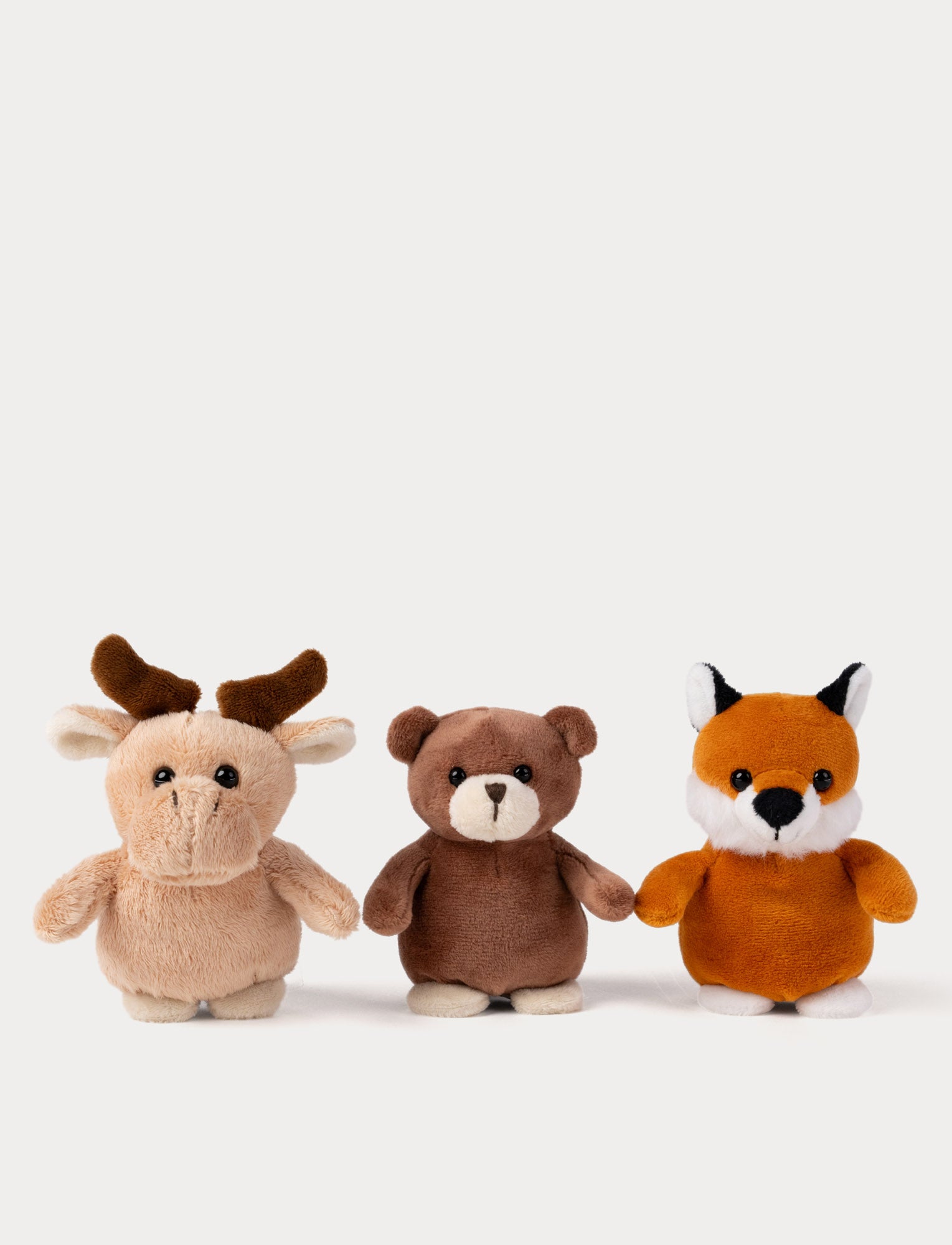  Image of Three plush toys shaped like a moose, bear, and fox on a white background