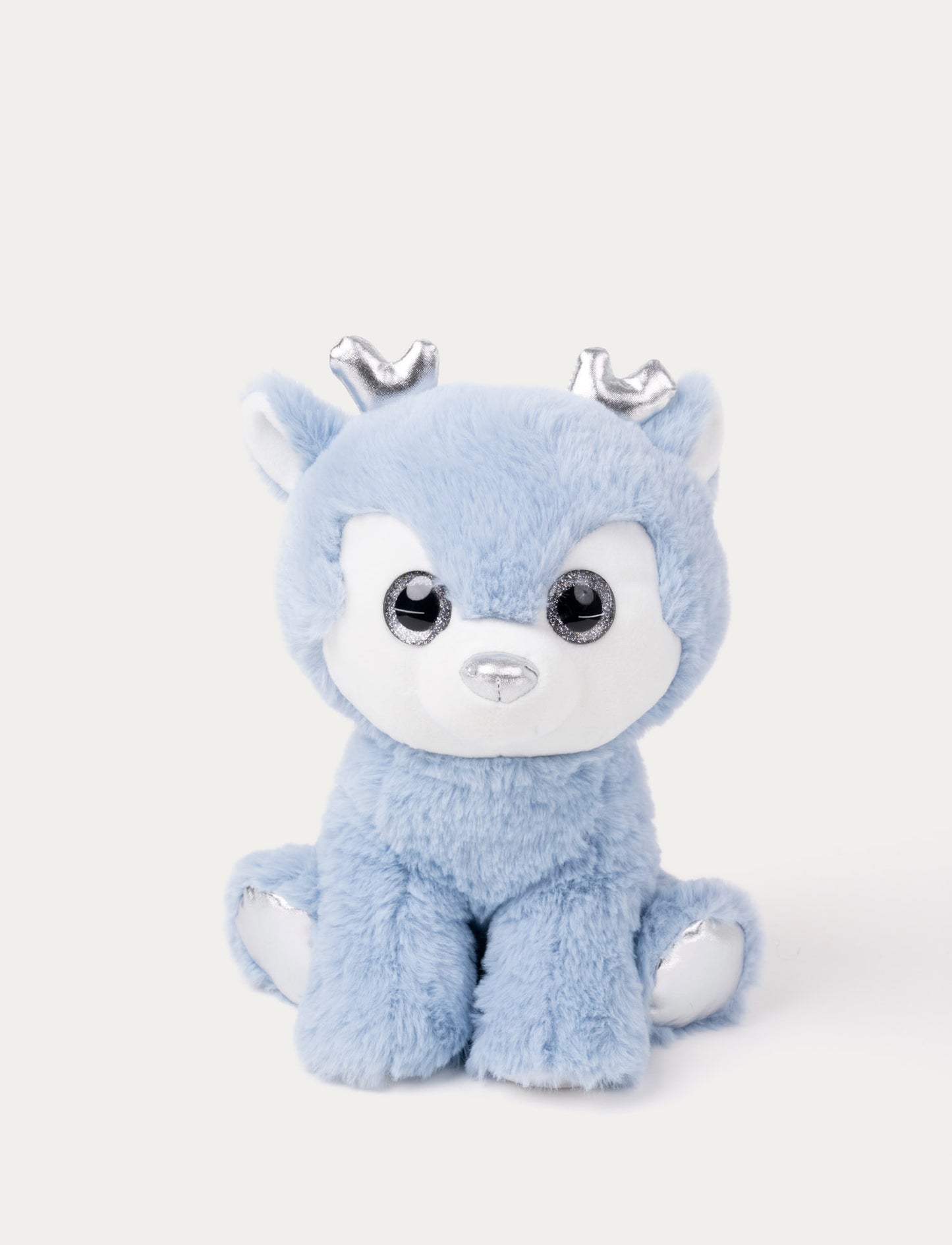 A teal plush deer with large silver eyes and shimmering silver details on her antlers and feet.