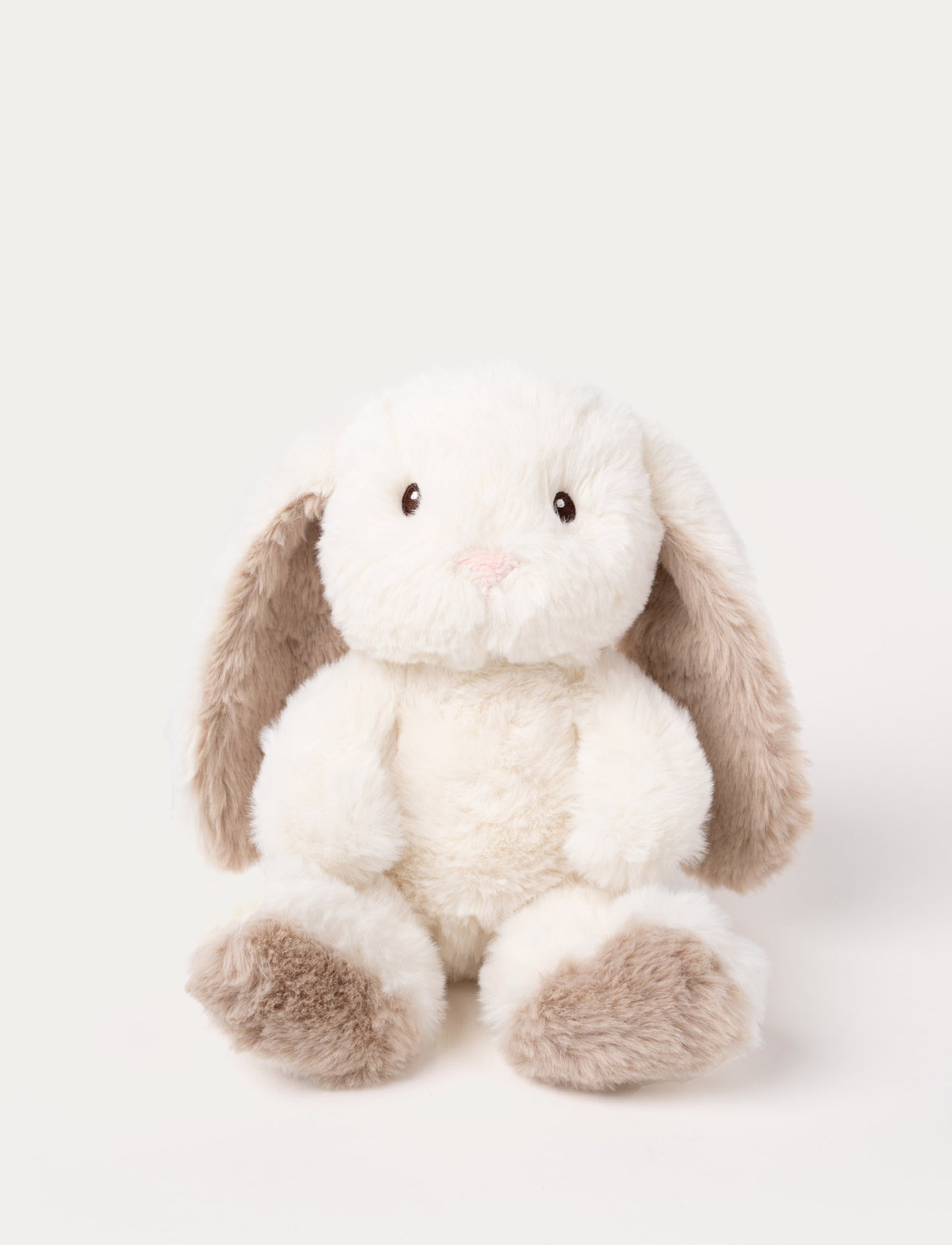 A cream plush bunny with silky-soft fur, faux suede detail on its back, and embroidered eyes.