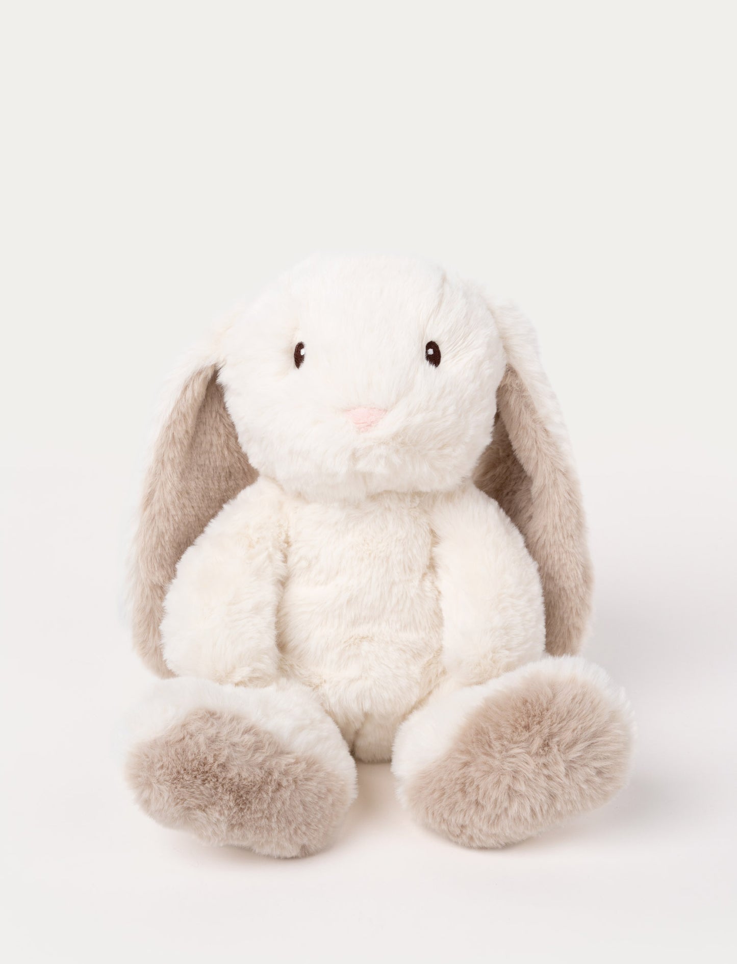 A cream plush bunny with silky-soft fur, faux suede detail on its back, and embroidered eyes.