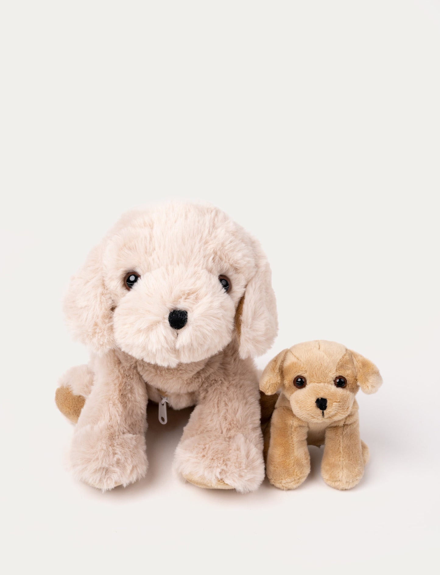 A soft 2-in-1 toy featuring a mother dog and puppy that can be placed inside Tess's belly.