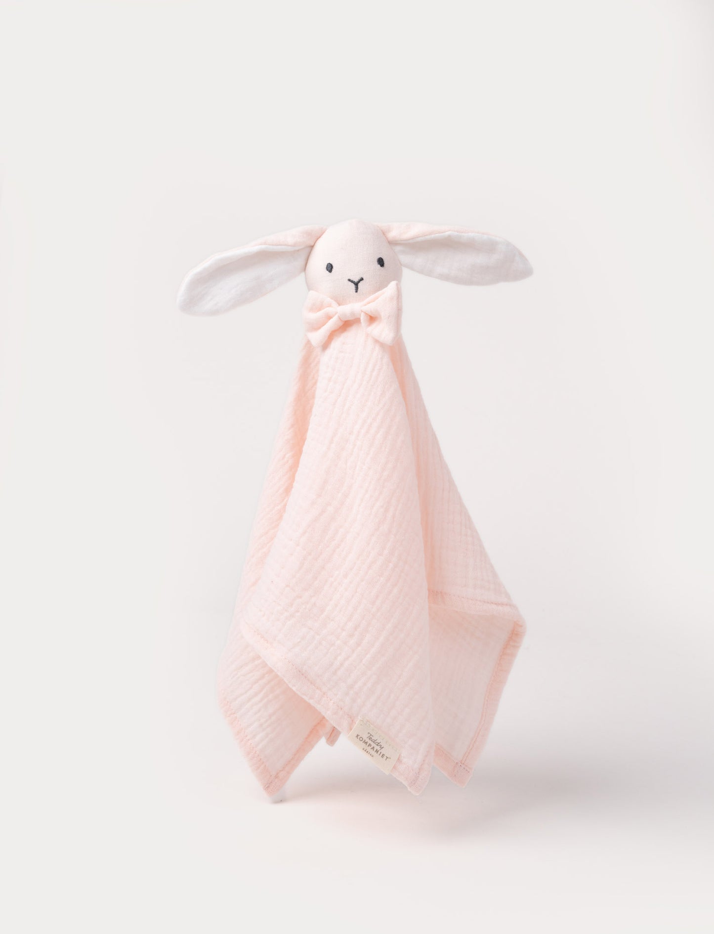 Soft baby blanket with a plush pink bunny head, long floppy ears, and a small bow.