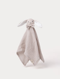 Soft baby blanket with a plush beige bunny head, long floppy ears, and a small bow.