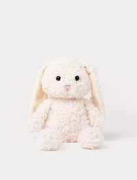 Soft white bunny plush toy with curly fur and long floppy ears.