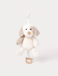 Soft musical plush dog toy with beige and white fur and wooden pull ring.
