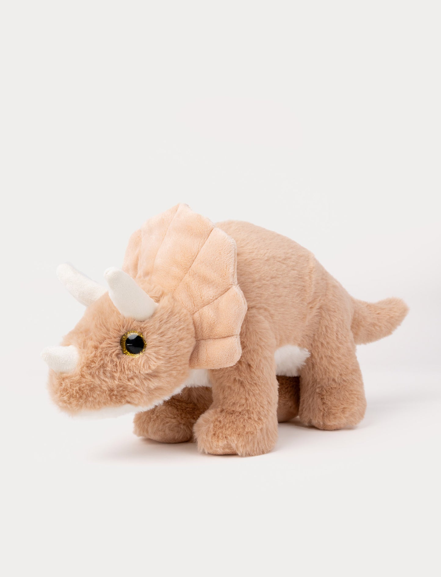 Soft peach Triceratops dinosaur plush toy with fluffy fur and three white horns