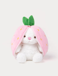 White plush bunny sitting inside a pink strawberry pouch with zipper and green leaves on top.