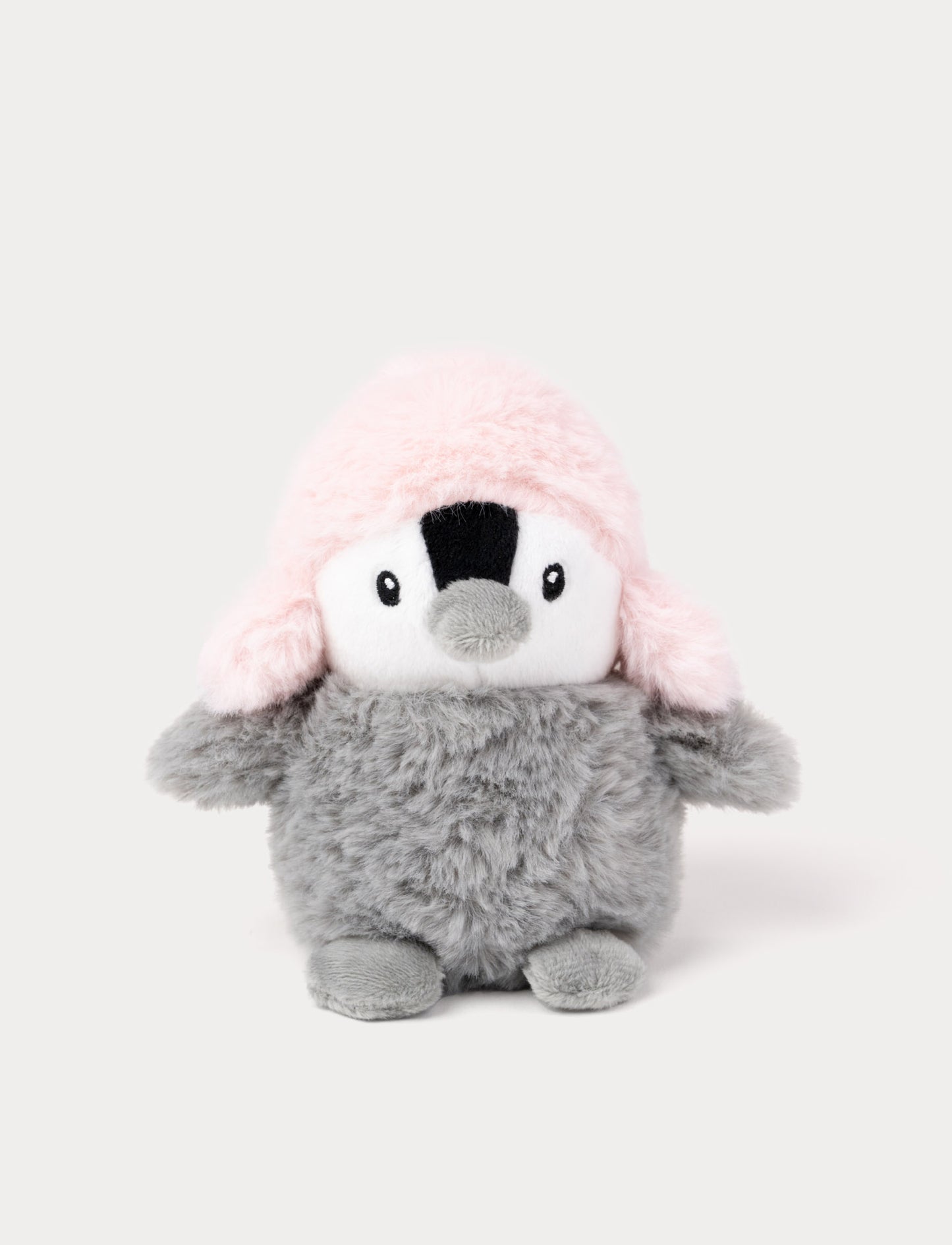 Fluffy grey penguin plush with a pink hat.