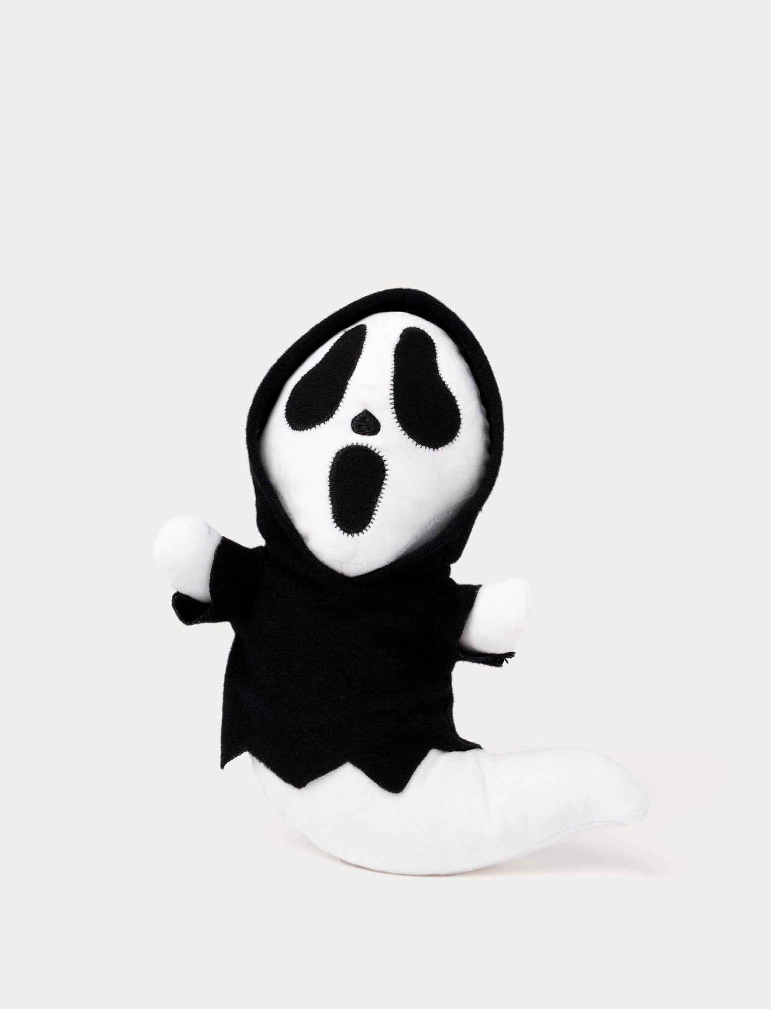  Image of Soft ghost plush toy with black hood and glow-in-the-dark effect.