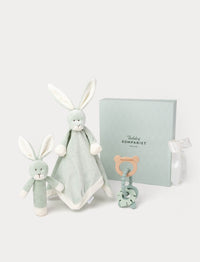 Set of baby toys including a rabbit-shaped comfort blanket, rattle and a teether, in a green gift box