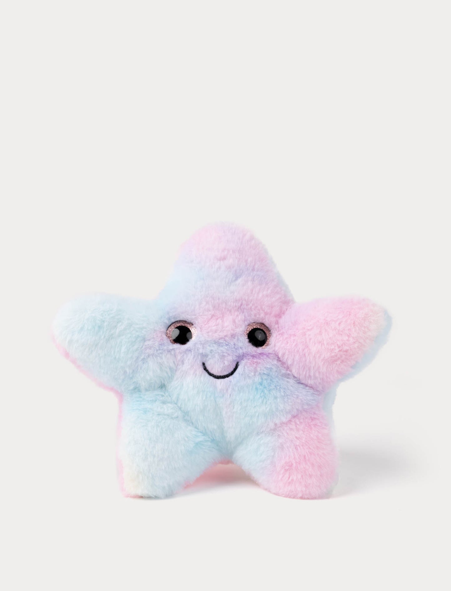 Pastel-colored plush starfish toy on a white background