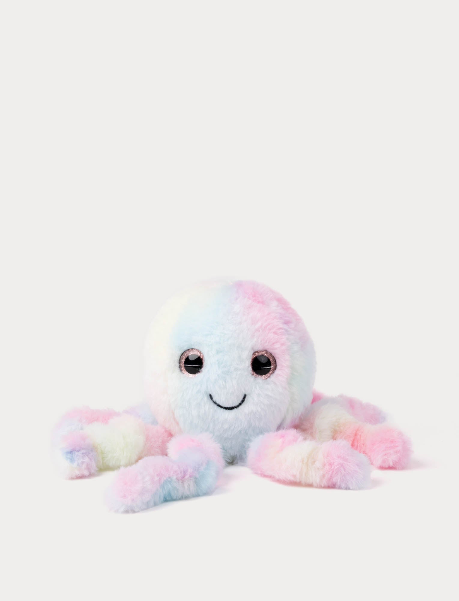  Image of Pastel-colored plush octopus toy on a white background
