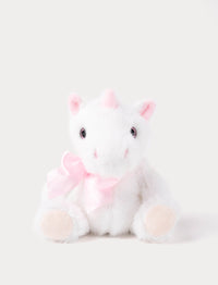 White plush unicorn toy with pink bow and ears on a light gray background