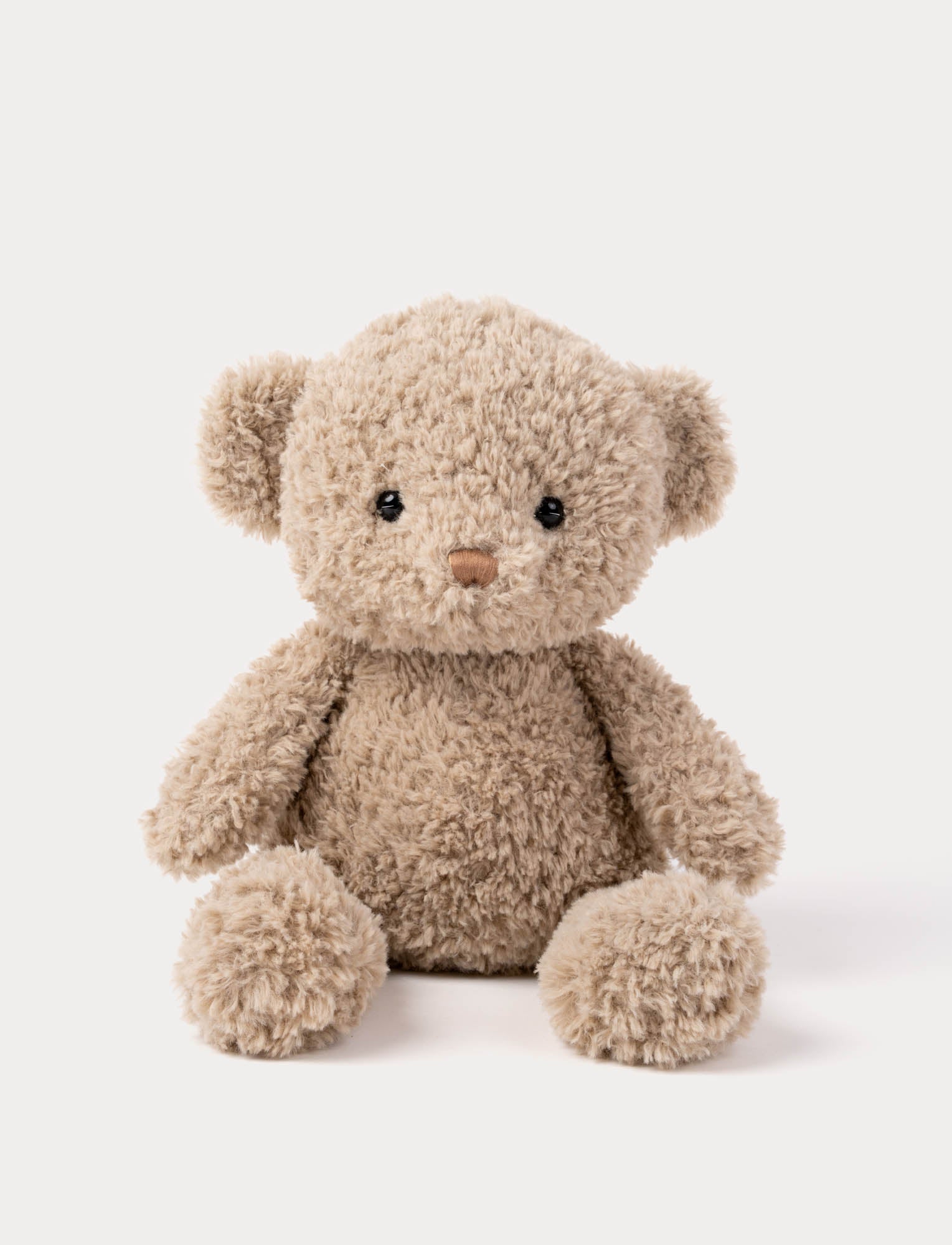  Image of Plush teddy bear in beige with curly fur