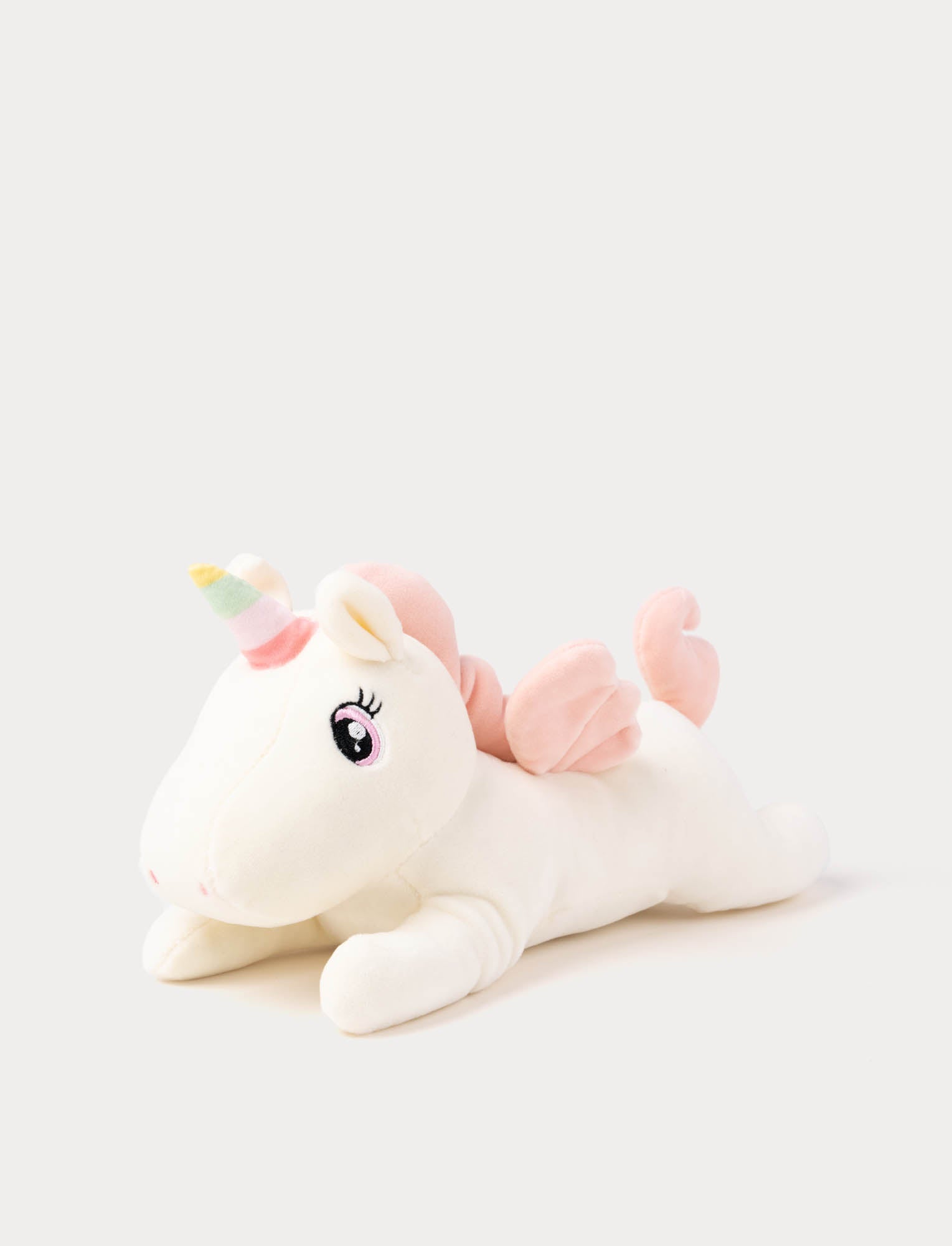  Image of White unicorn plush toy with a rainbow horn