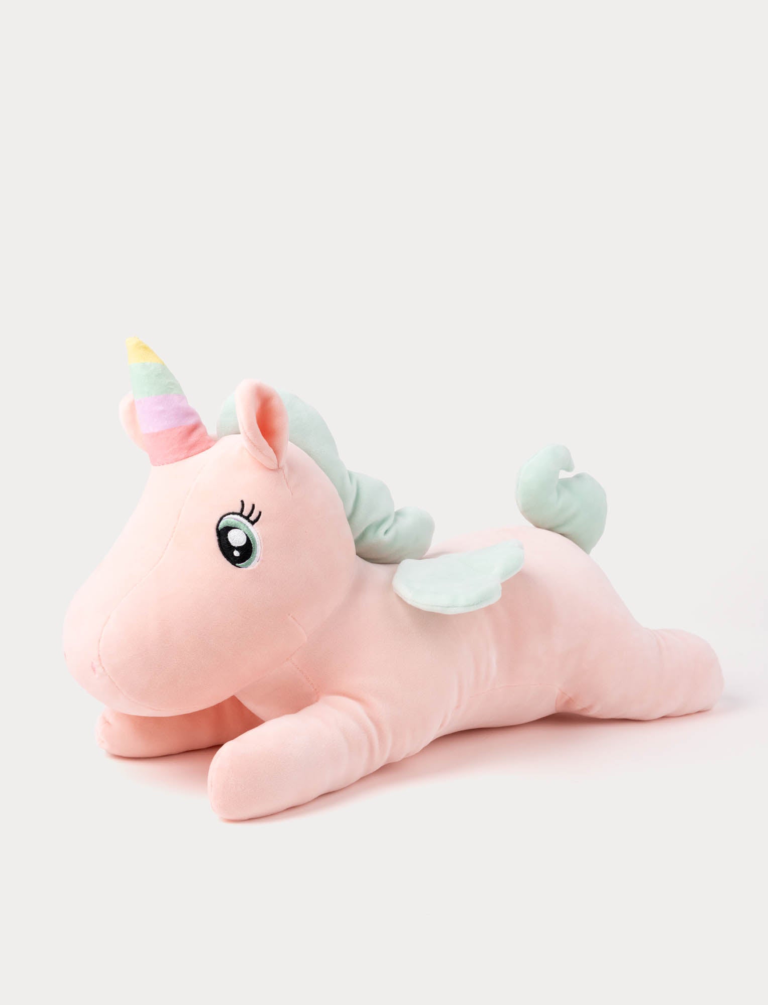  Image of Pink unicorn plush toy with a rainbow horn