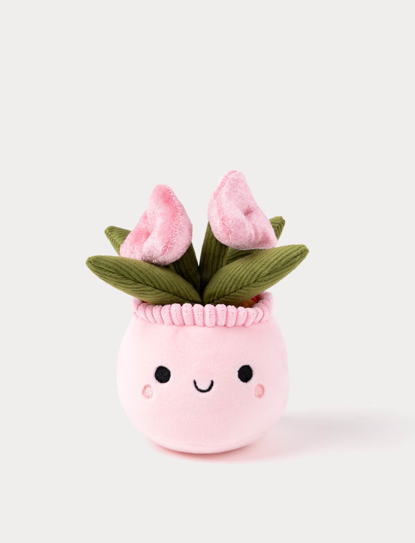 Plush toy resembling a pink flower pot with tulips on a white background