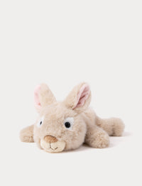 Plush beige toy bunny lying down
