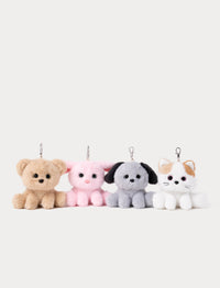 Four small plush keychains shaped like a bear, bunny, dog, and cat on a white background
