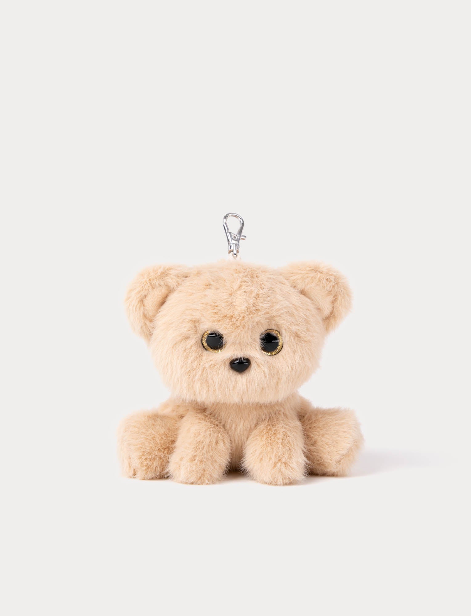  Image of Small beige teddy bear keychain on a white background