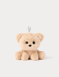 Small beige teddy bear keychain on a white background